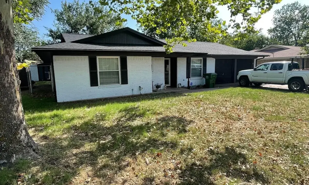 Professional roofing crew working on a residential roof in Martinsville